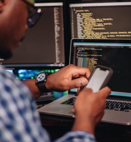 african-american-man-sitting-at-computer-developer-2024-11-01-02-32-54-utc